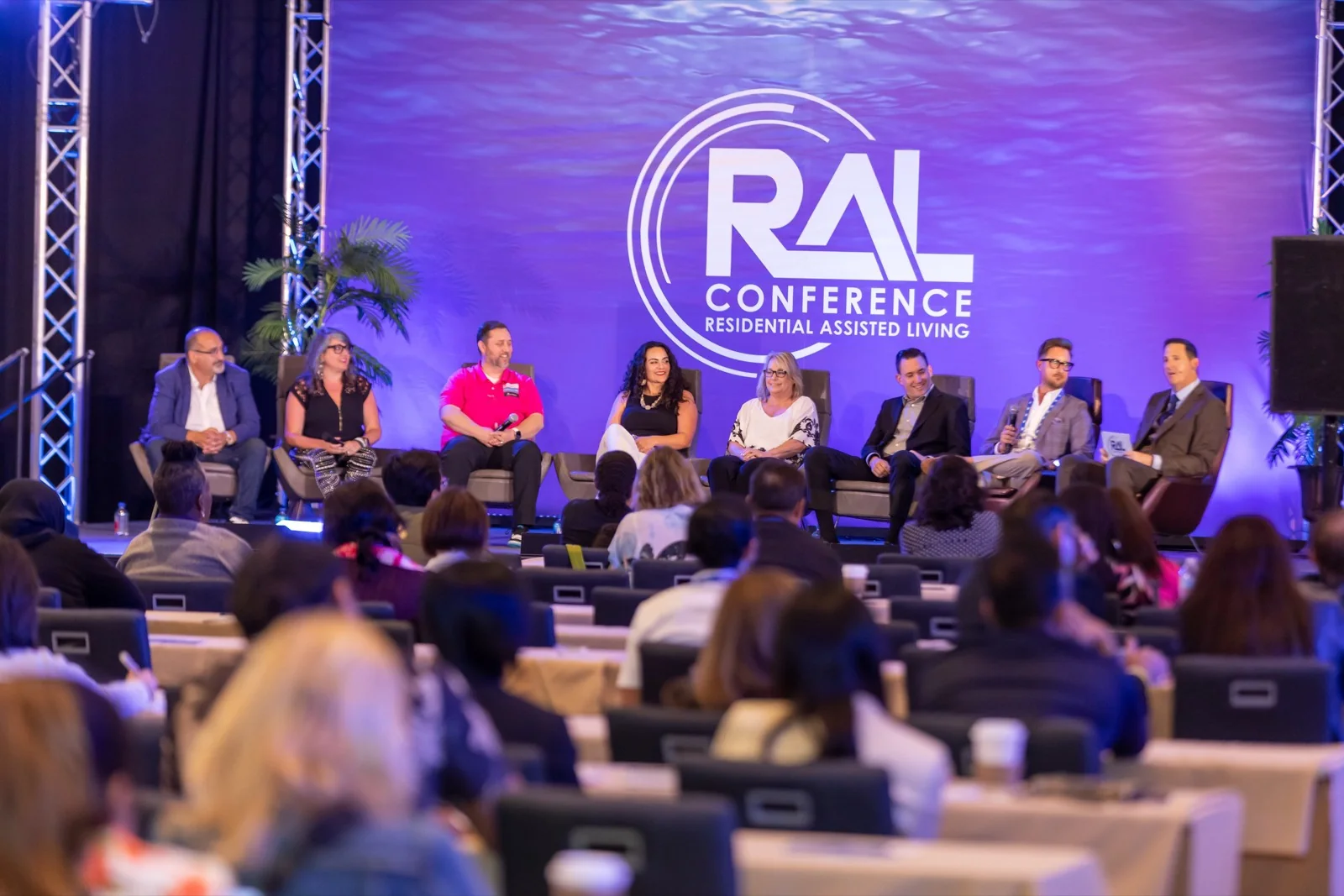 A six-person panel discussion on stage at a Los Angeles conference