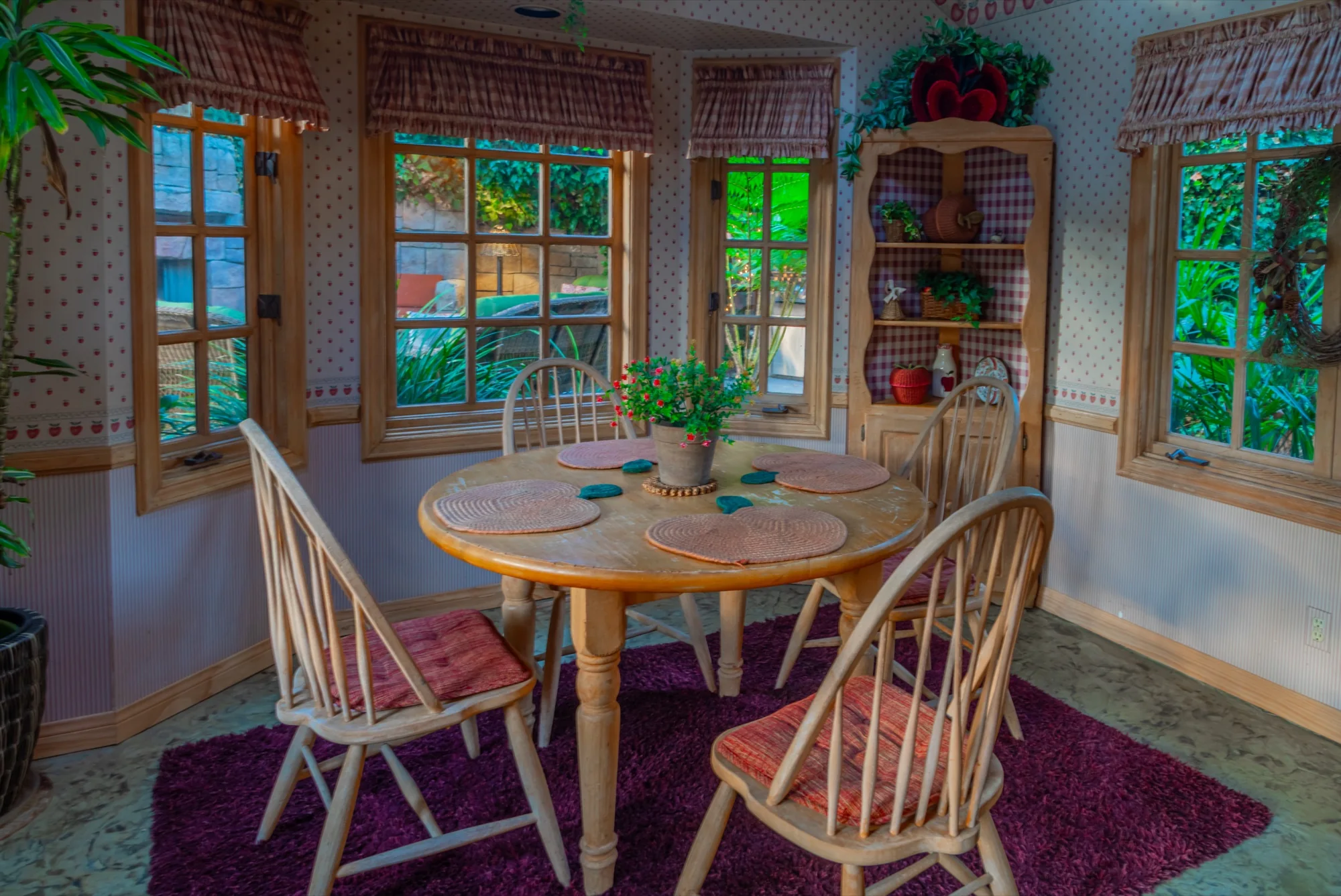 The windowed breakfast nook in the cottage at The Enchanted Manor
