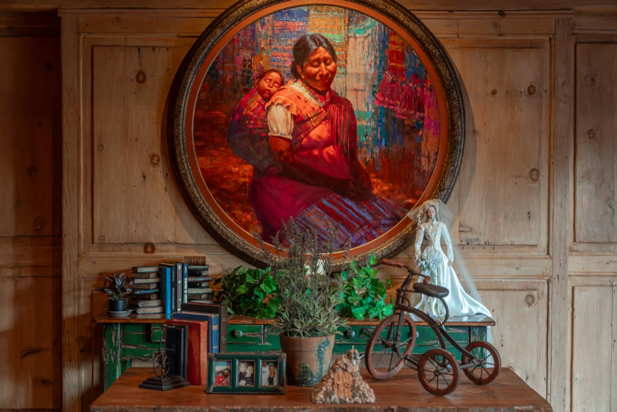 A painted portrait set into the wood panelling at The Enchanted Manor