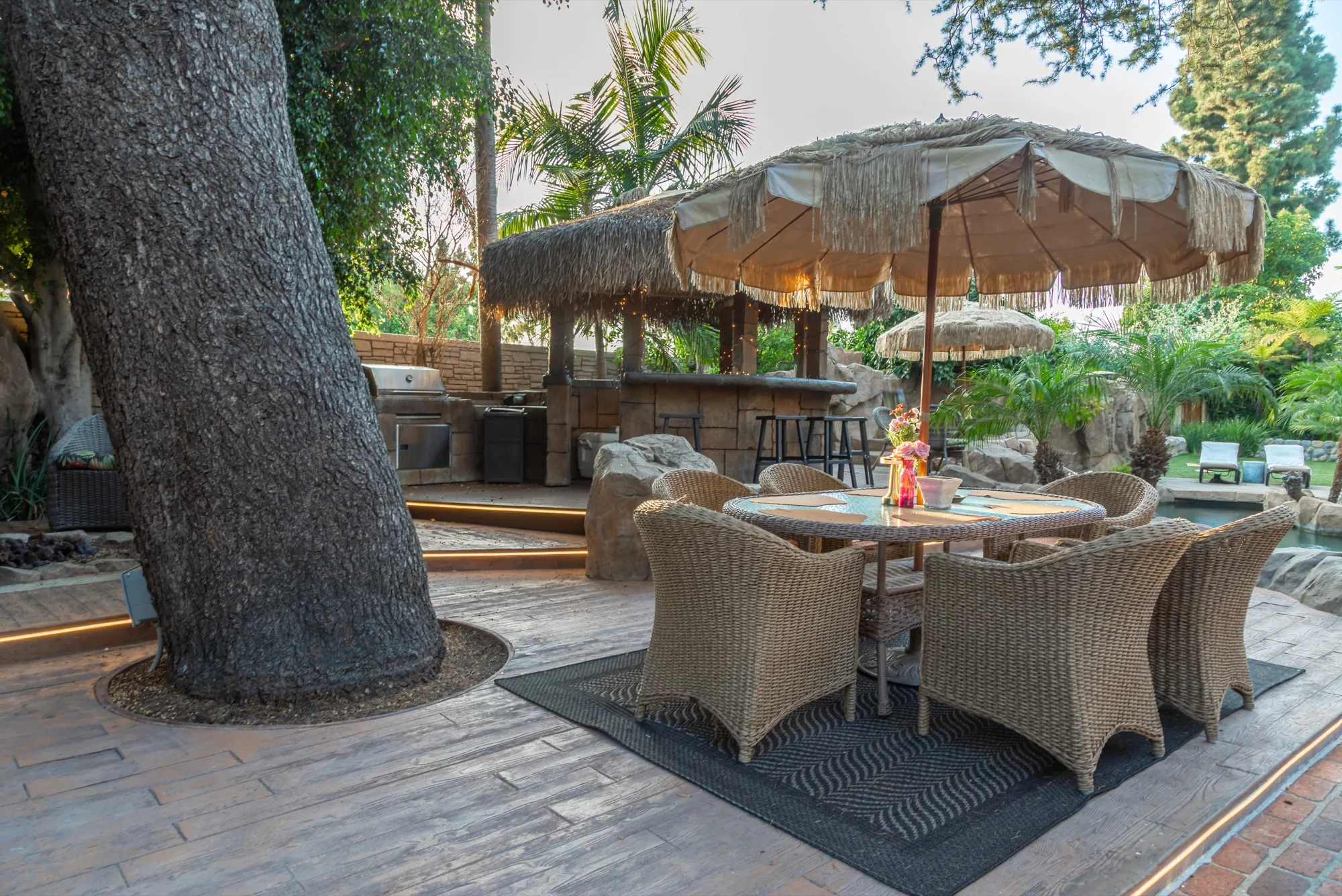 Dining under the great tree by the gazebo bar at The Enchanted Manor
