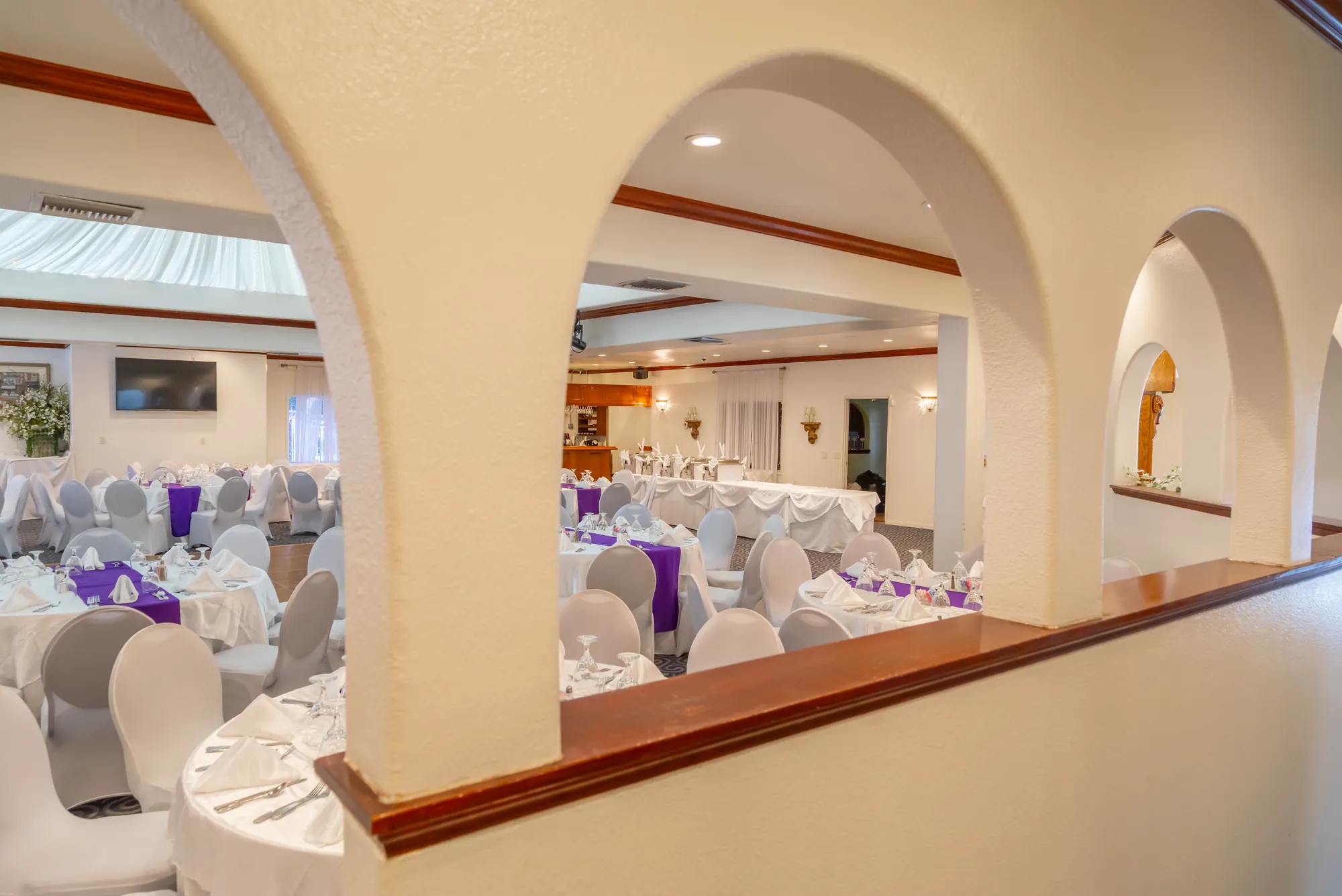 The row of plaster arches looking into the banquet room at Kelly's Wedding Garden