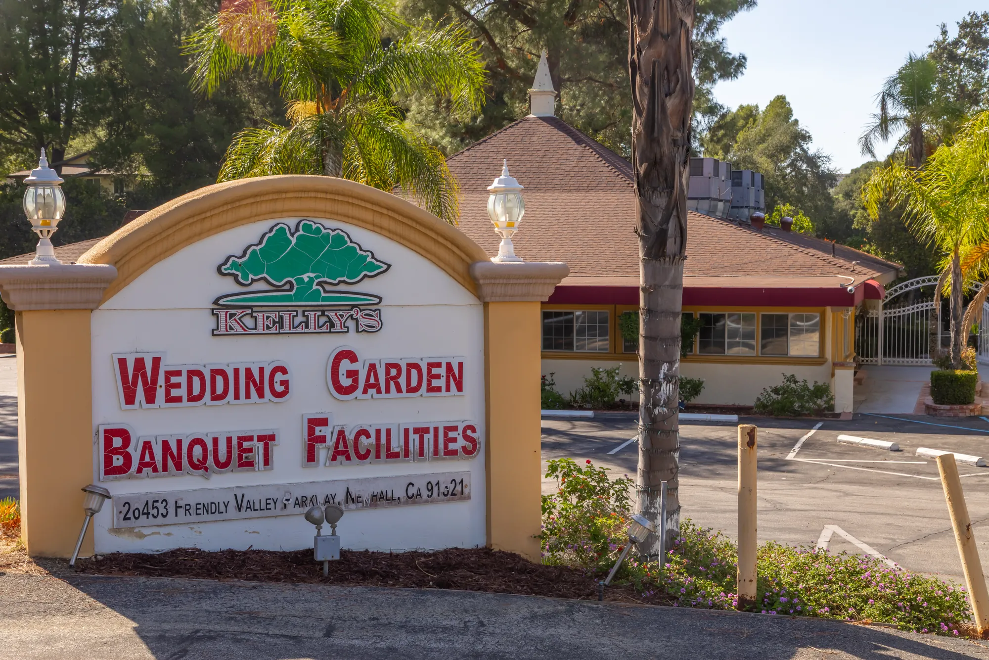 The Kelly's Wedding Garden and Banquet Facilities sign at the entrance on Friendly Valley Parkway