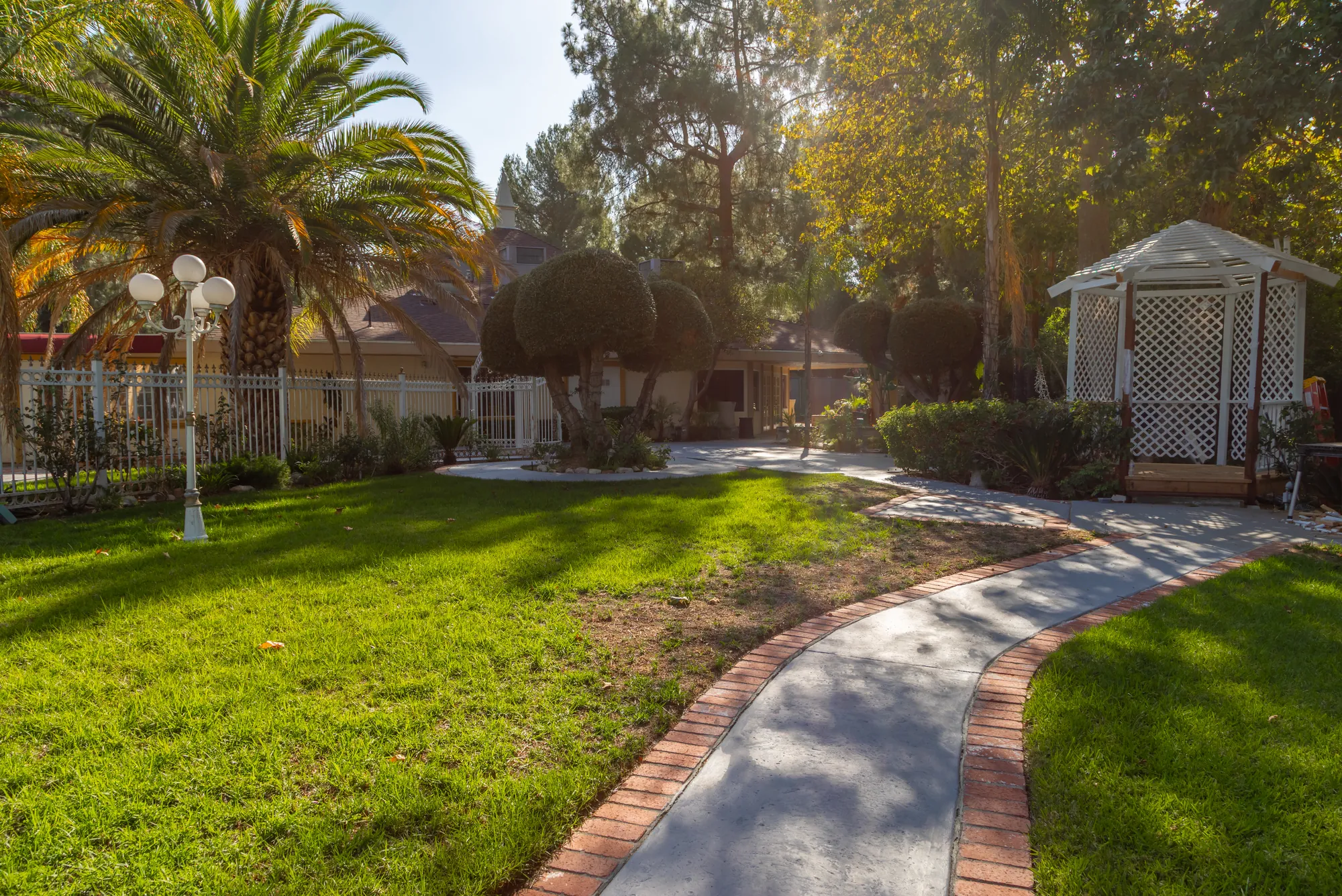 The curving brick-edged path leading to the gazebo at Kelly's Wedding Garden