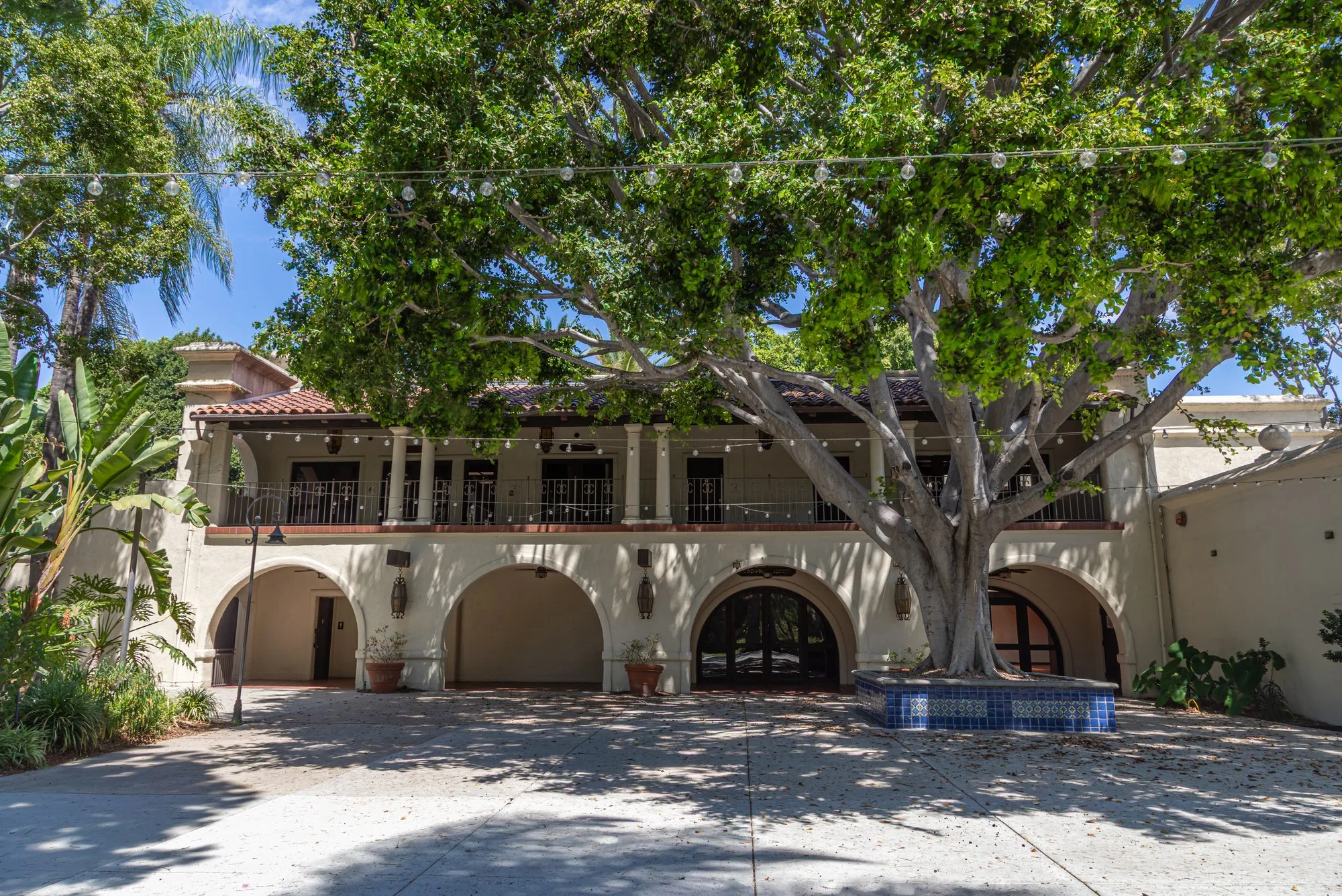 The arcaded building seen across the main courtyard at the LA River Center