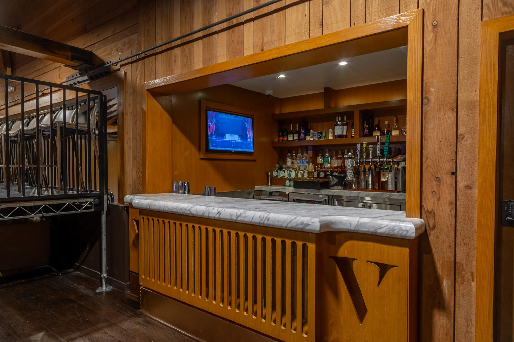 The panelled bar with the house monogram at The Vermont Hollywood
