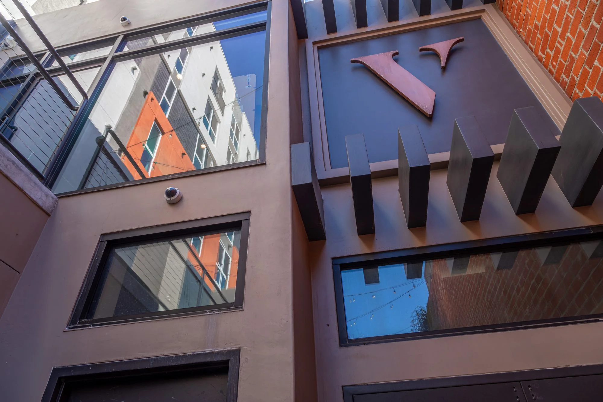 Looking up at the monogram over the entrance at The Vermont Hollywood