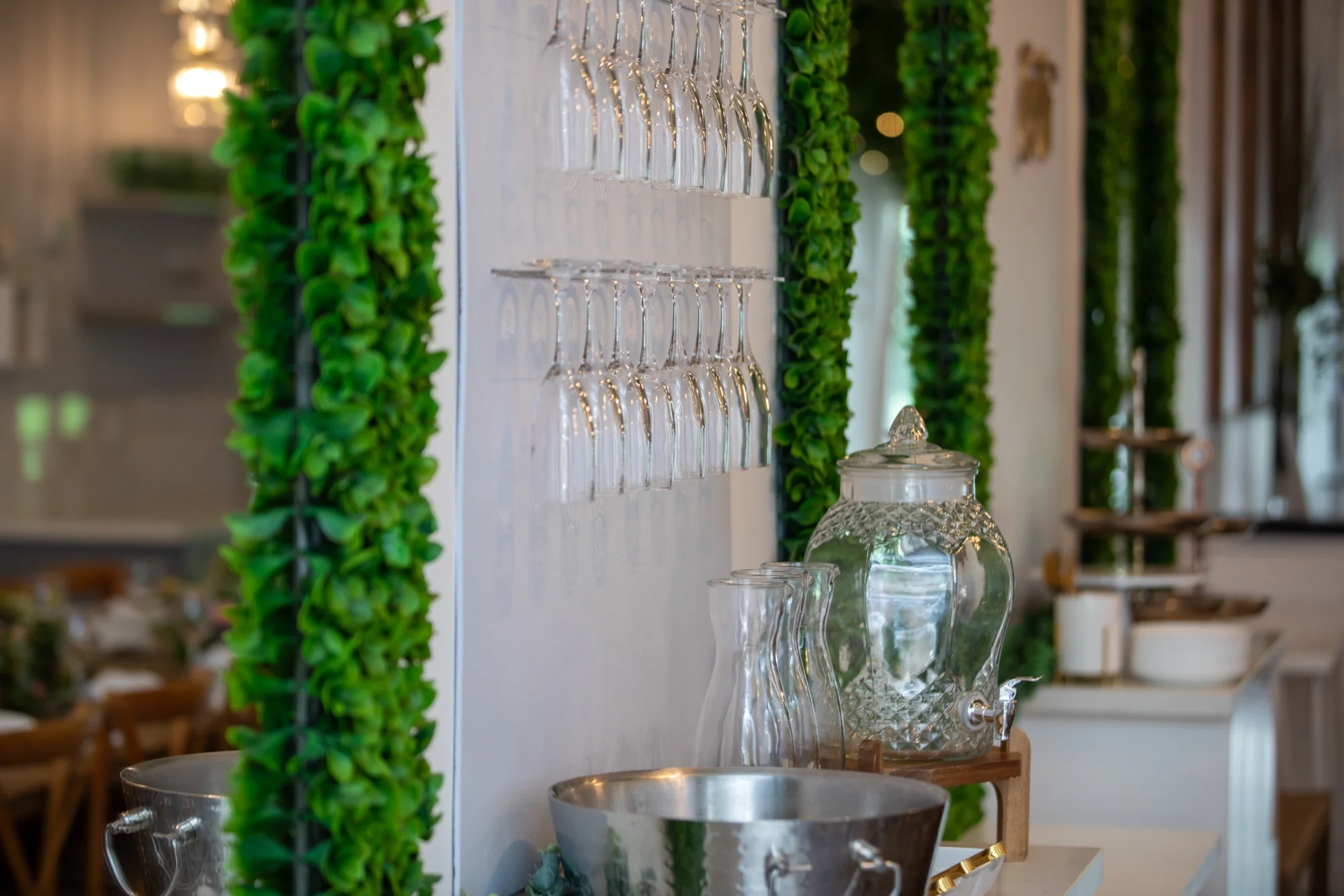 The hanging glassware wall at Violet Cactus Petite