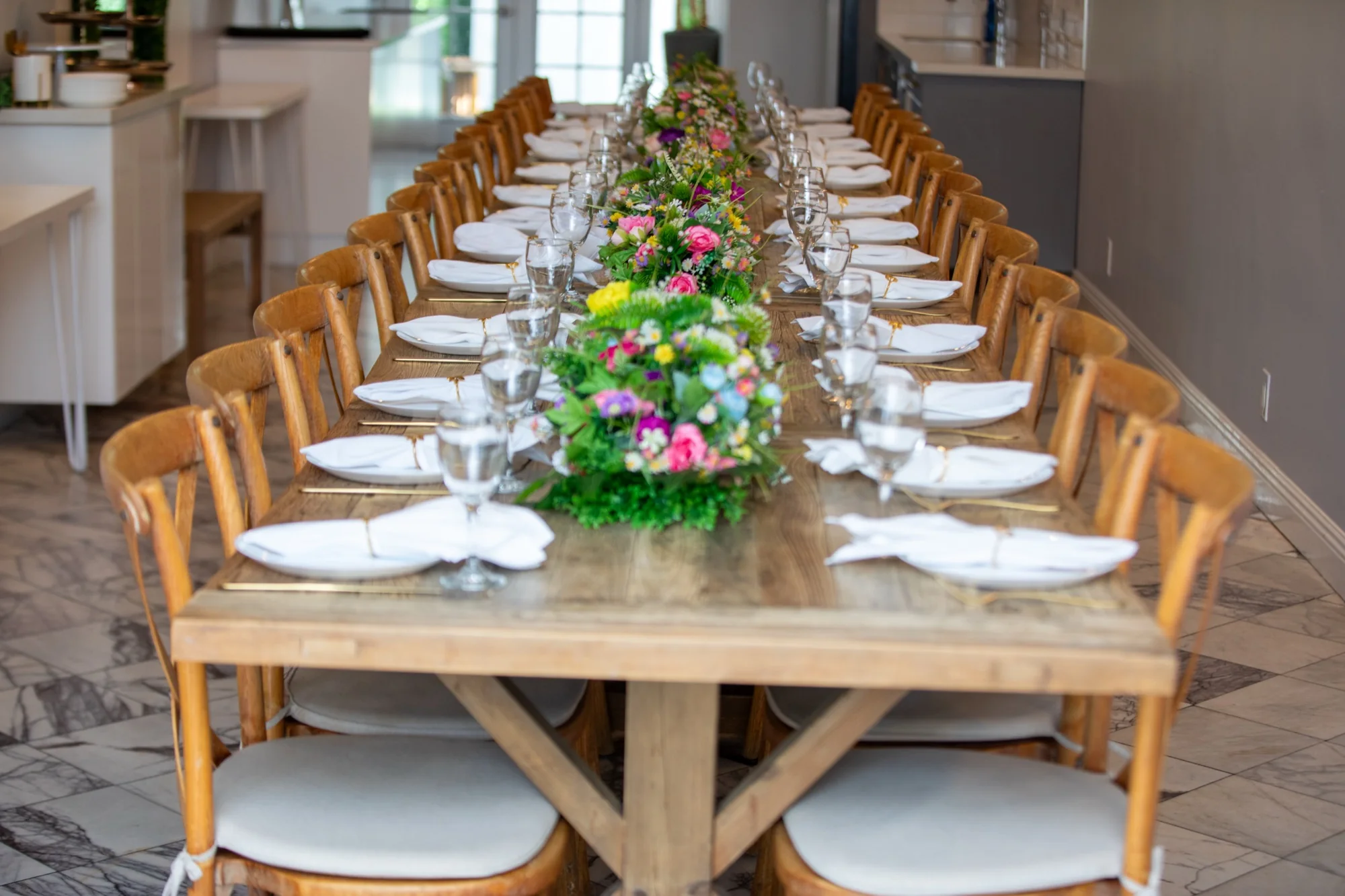 The 24-foot farmhouse table at Violet Cactus Petite, photographed by ConneryFilm