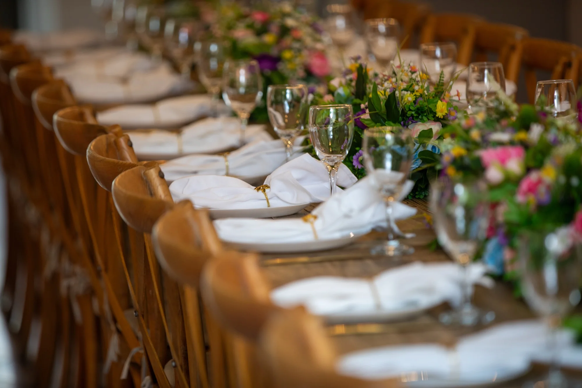 Place settings down the long table at Violet Cactus Petite