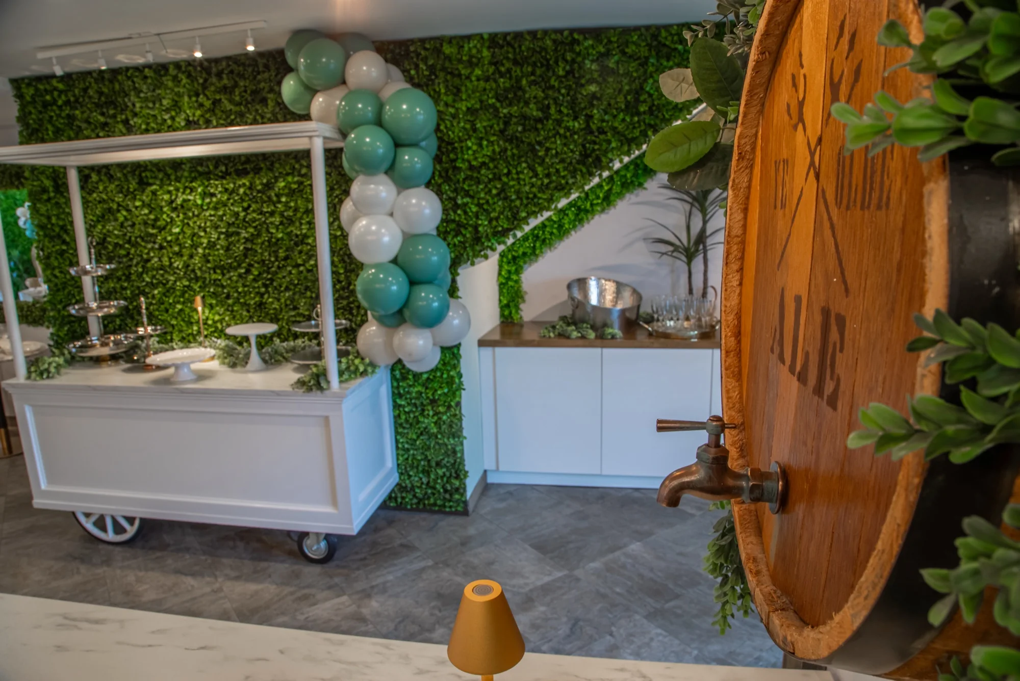 The white cart dressed with balloons at Violet Cactus Studio