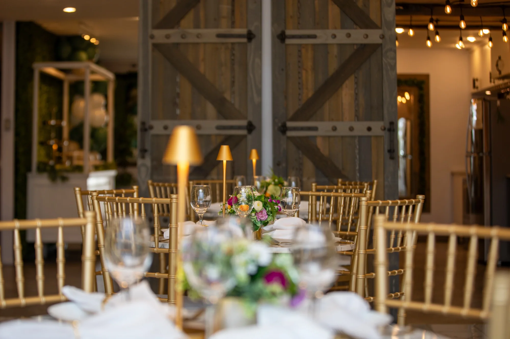 The sliding barn doors and set tables at Violet Cactus Studio