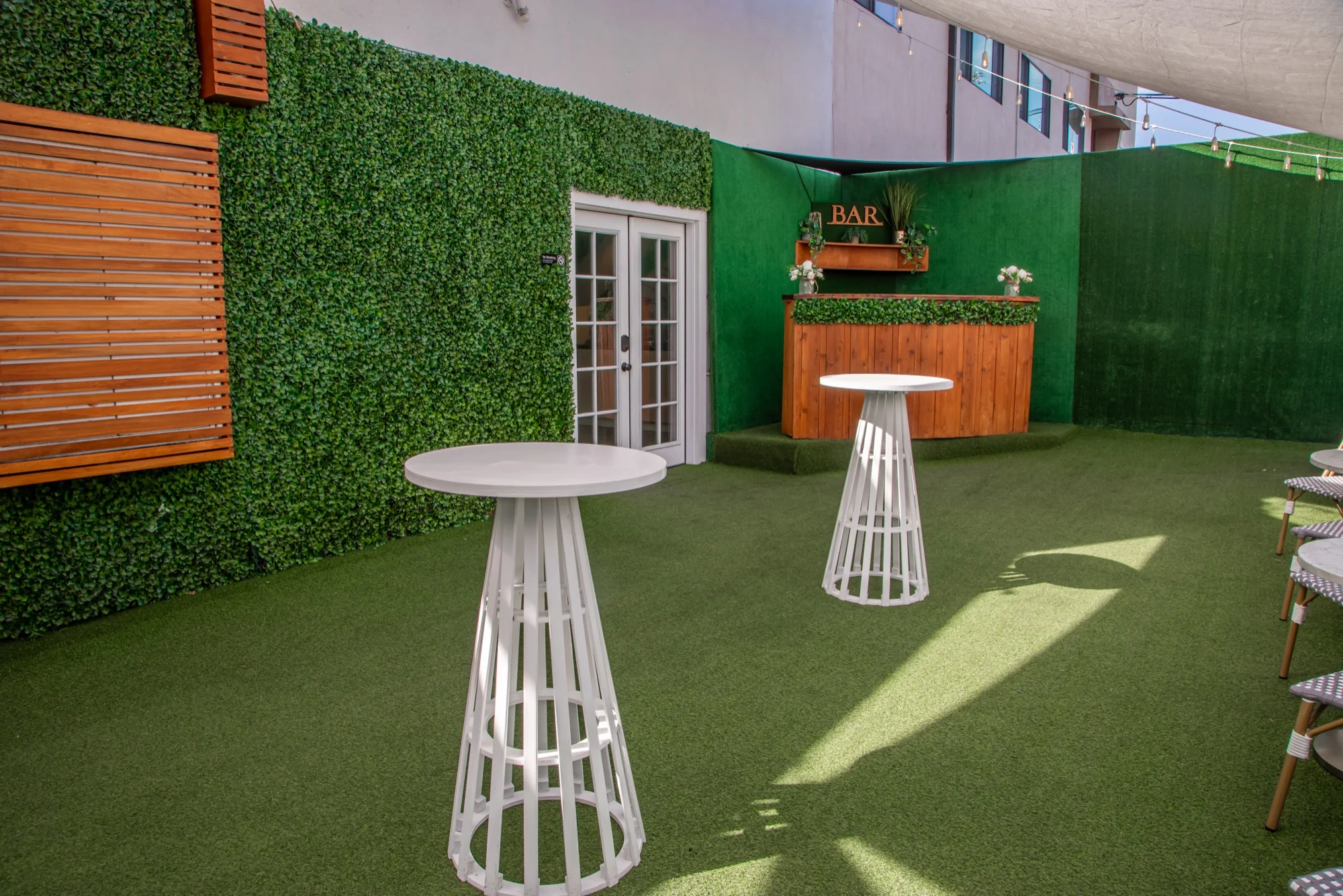 The turf patio and cocktail tables at Violet Cactus Studio